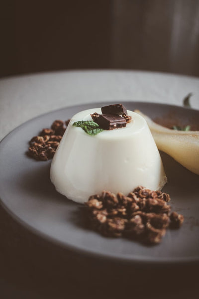 Spiced Pannacotta with Poached Pears and Cacao & Hazelnut Granola